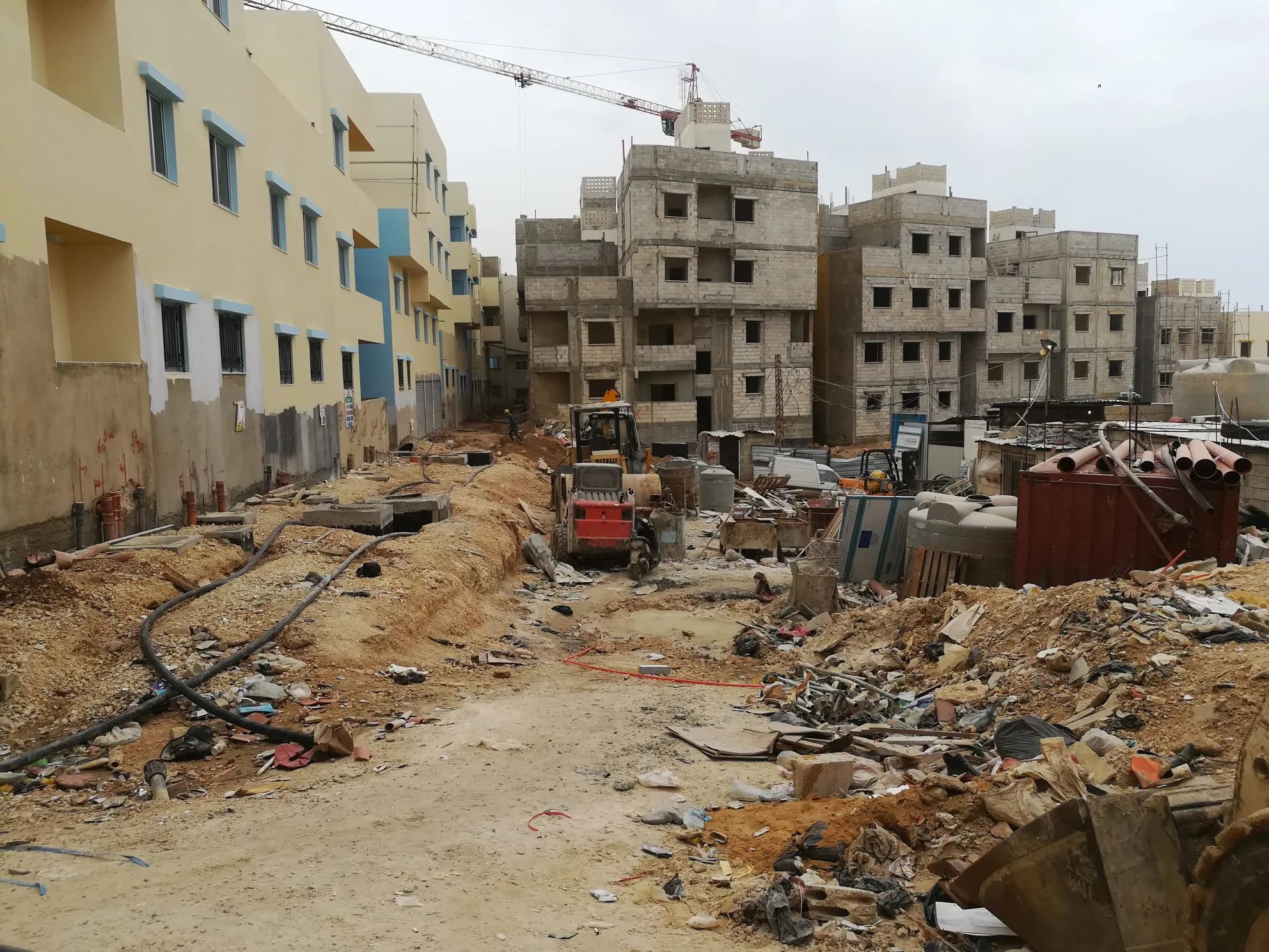 Urban construction zone with active works and safety constraints